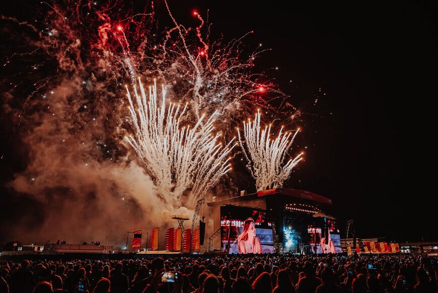 Reading Festival main stage at night with fireworks